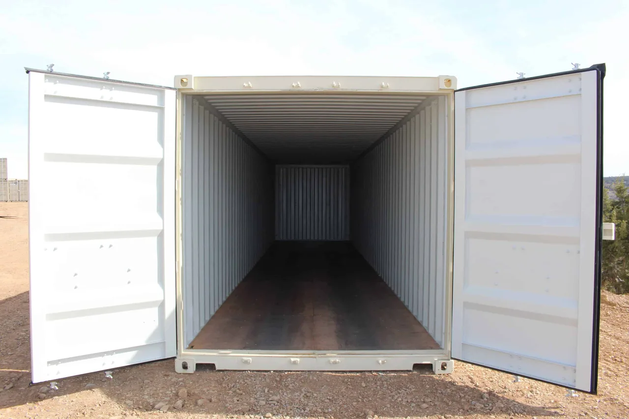 Storage container with both doors open wide showing completely empty interior ready for modification
