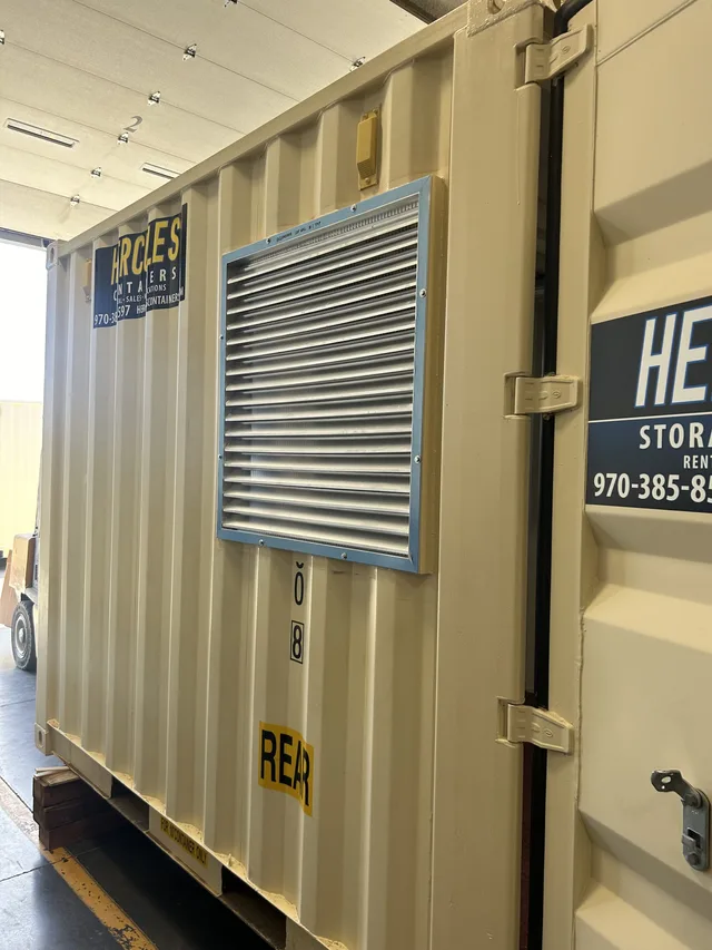 Custom paint and weather sealing on a generator container enclosure
