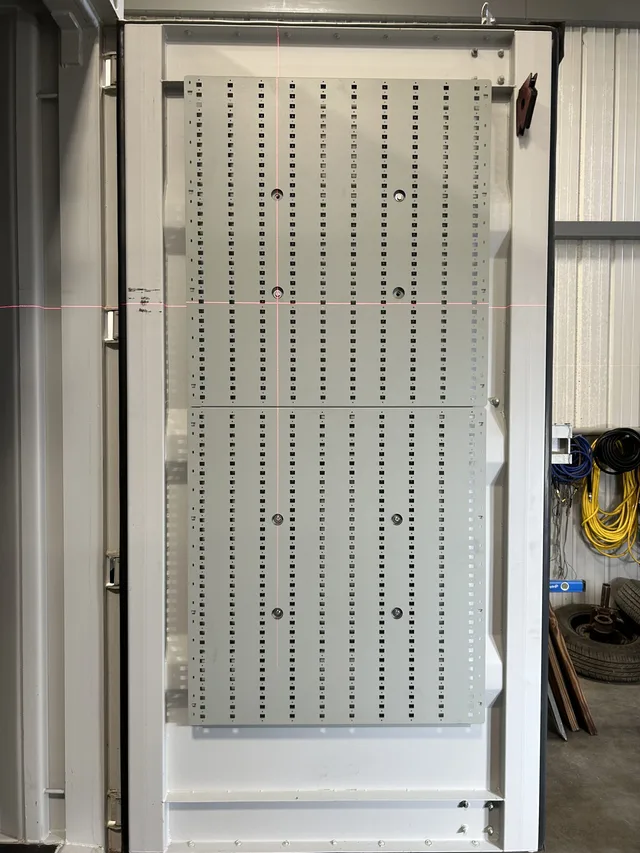 Exterior paint and branding on a completed Gunfighter container