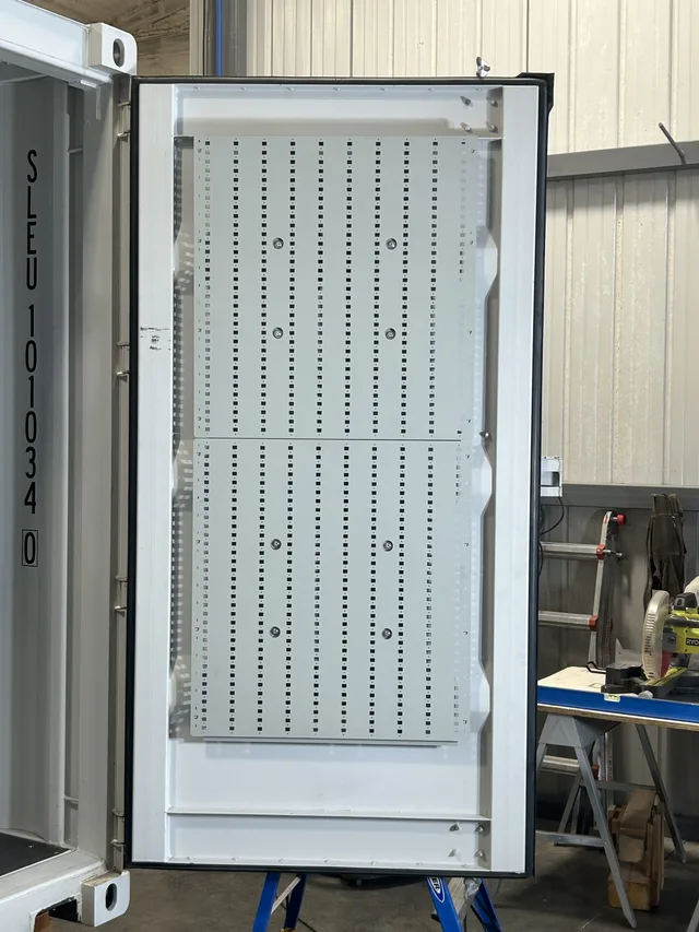 Insulation and wall panel installation in a Gunfighter container conversion