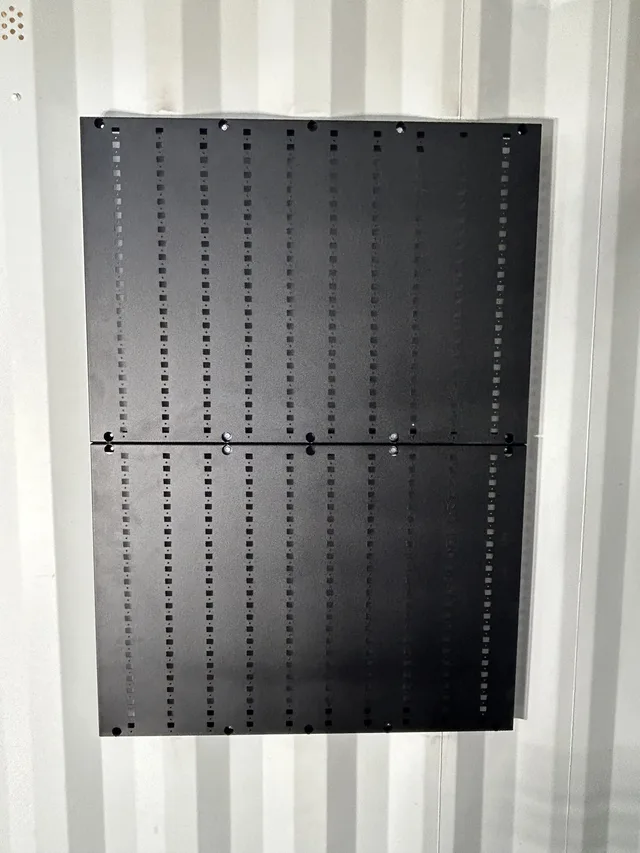 Progress photo of framing and insulation in a Gunfighter container