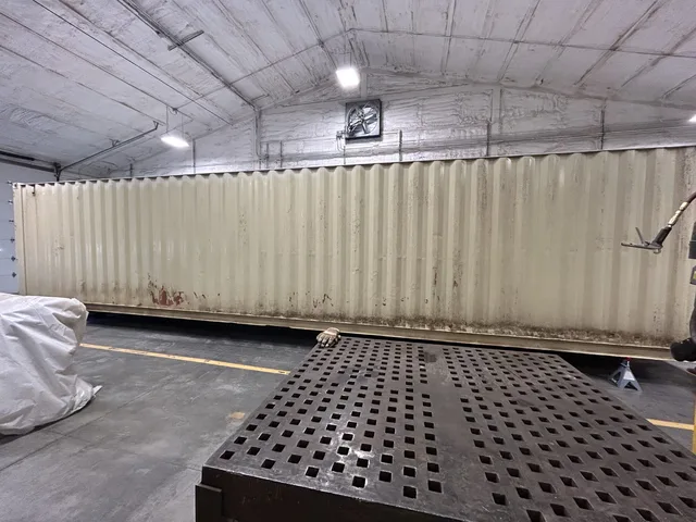 Interior drywall and paint finish in a container conversion project