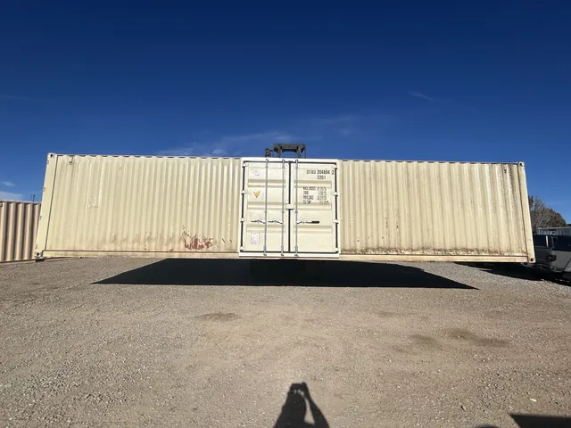 Modified container showing insulated steel door with peephole