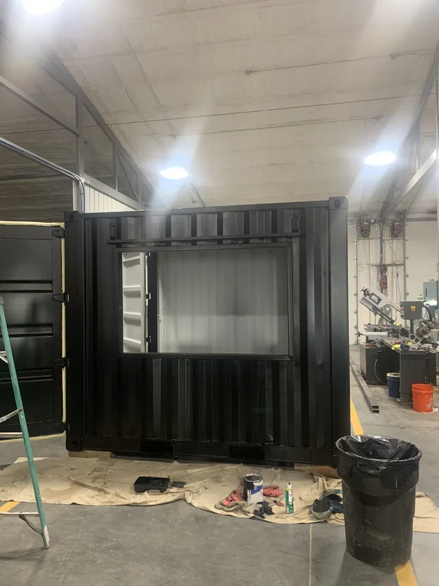 Custom container with corrugated metal interior paneling installed