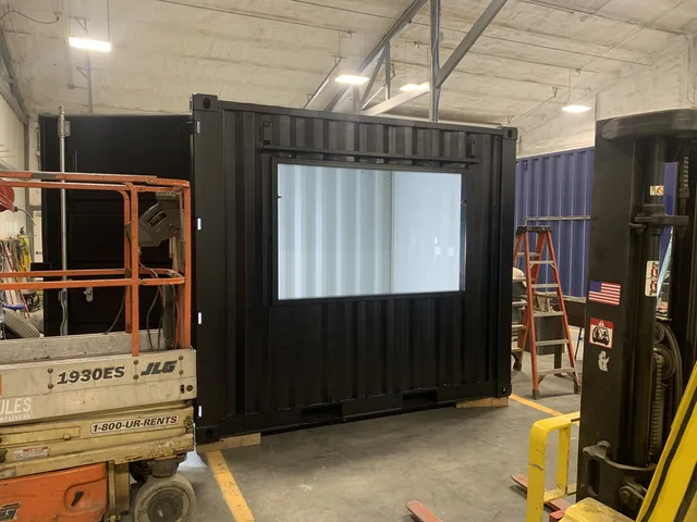 Container with reinforced roof for mounting satellite or antenna equipment