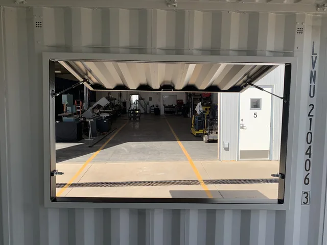 Container with custom floor coating and anti-slip surface treatment