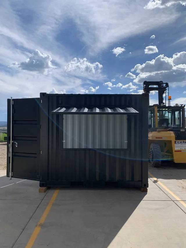 Container modification with fire-rated partition wall installation