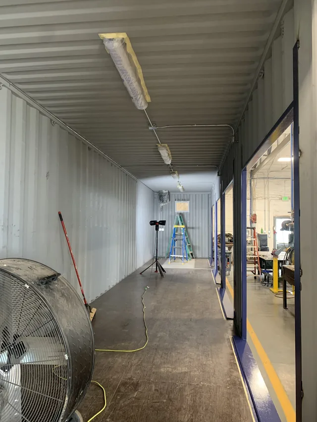 Completed container office with furniture and fixtures installed