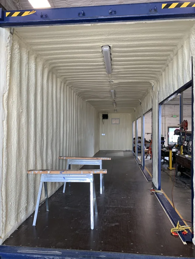 Welding work on a custom container modification at Hercules shop