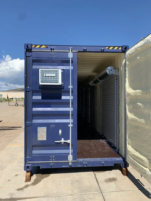 Window installation and exterior trim on a modified container