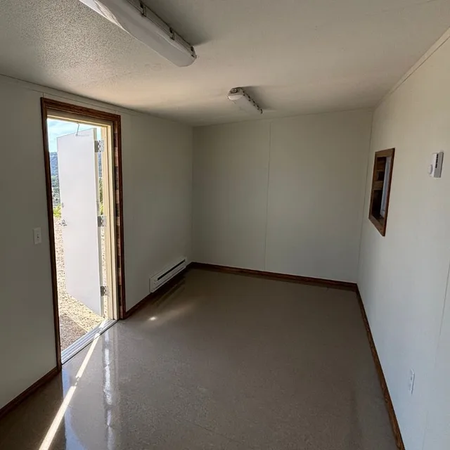 Container with end roll-up door upgrade for easy loading and unloading