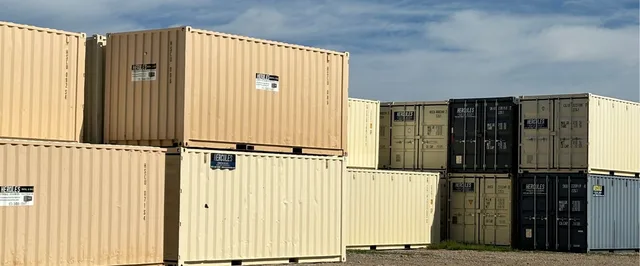 Multiple containers arranged at a job site for organized material storage