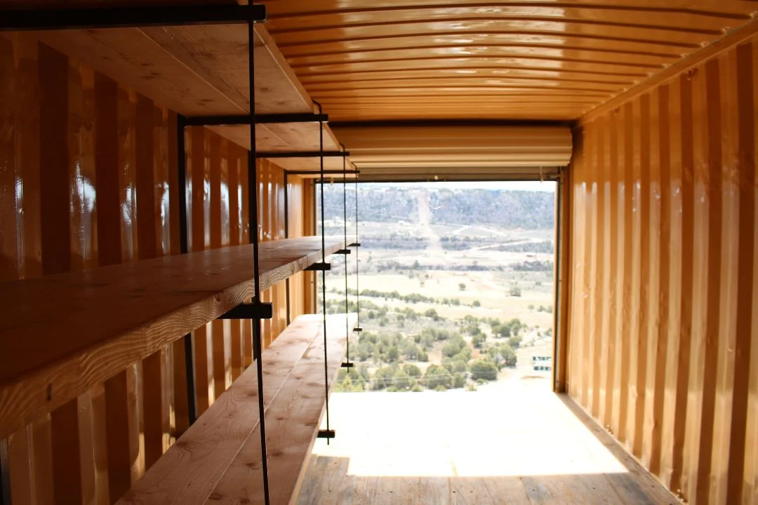 3212 shelving rack with lumber boards inside a container