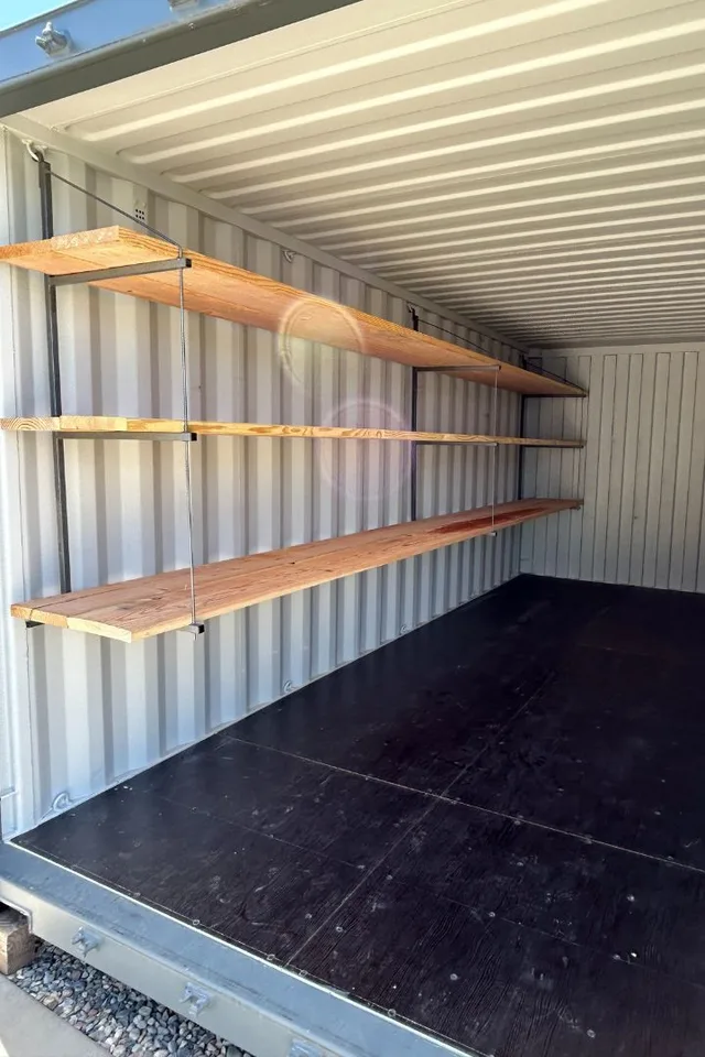 Shelving installation showing bolt-down anchoring for stability